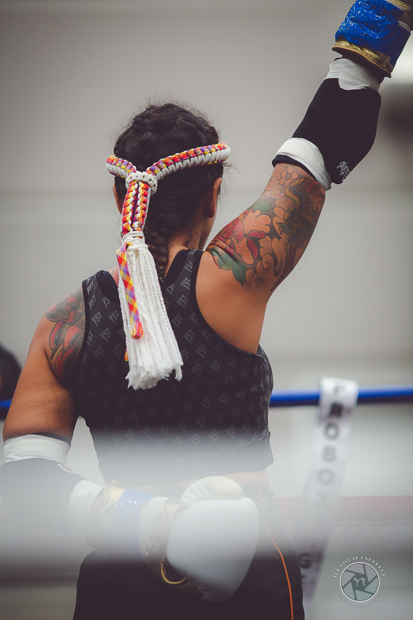 In the ring — mongkon headband, tattooed arm